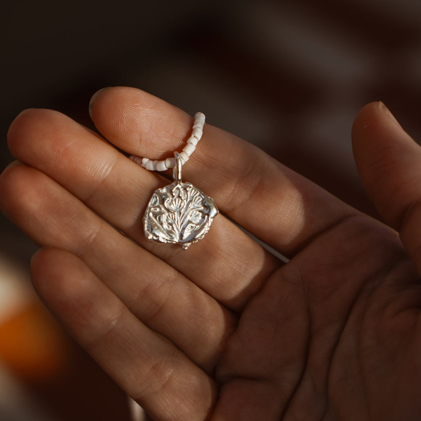 Puka Shell & Freshwater Pearl Necklace with Sterling Silver Flower Bouquet Charm - Golden Road Crafted