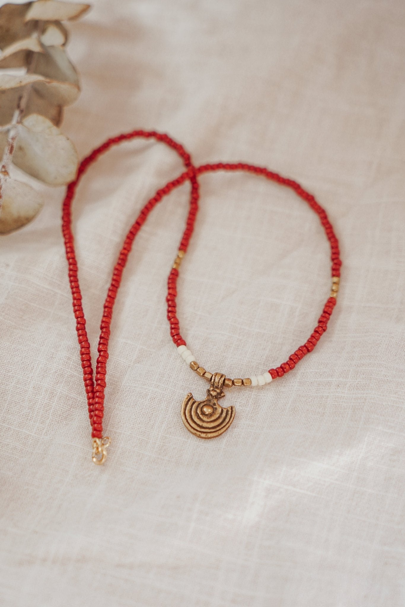 Shield Necklace in Red Beads - Golden Road Crafted