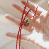 Shield Necklace in Red Beads - Golden Road Crafted