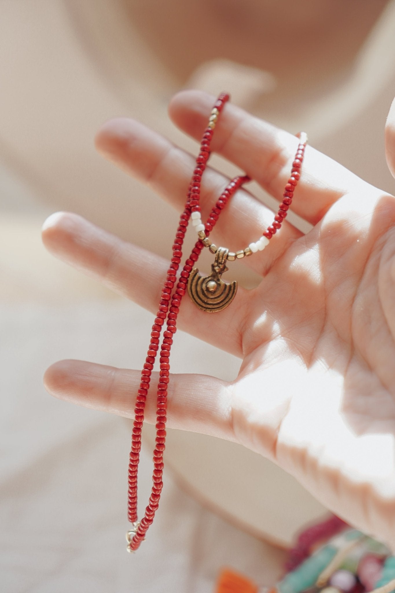 Shield Necklace in Red Beads - Golden Road Crafted