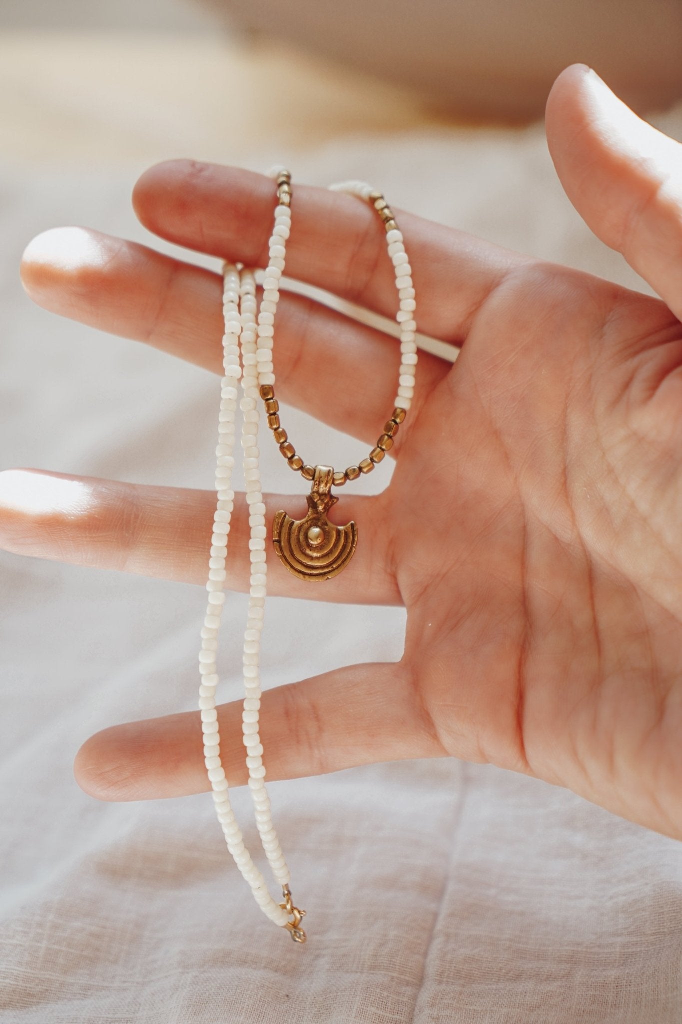 Shield Necklace in White Beads - Golden Road Crafted