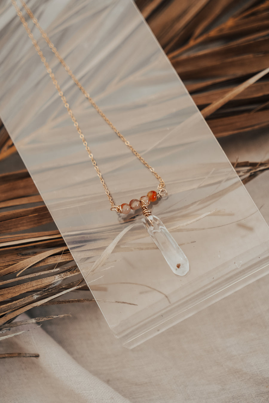 The Gravity Necklace with Clear Crystal Quartz & Carnelian